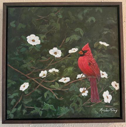 Red cardinal rests amount the dogwoods.